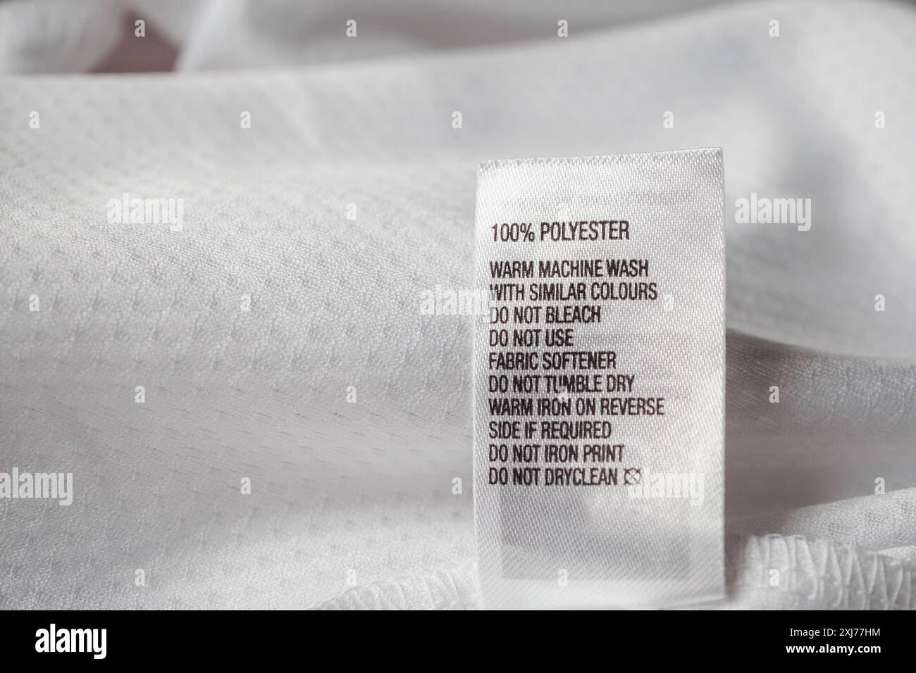 Polyester fabric Clothing label with laundry instructions Stock Photo ...