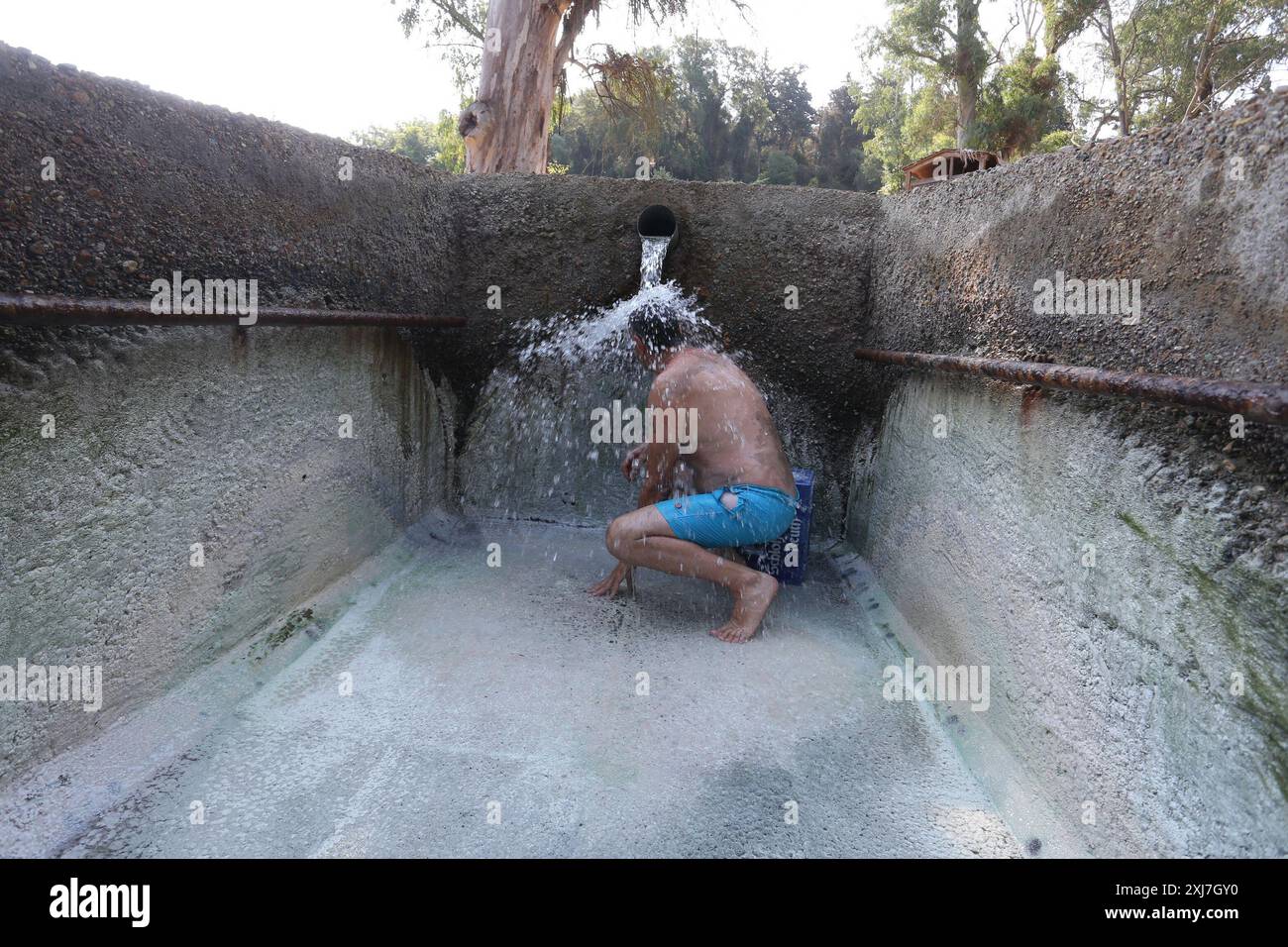 Man having a bath at the thermal springs of Kyllini. The thermal springs of Kyllini Baths have been known since antiquity. Also there was a hydrothera Stock Photo