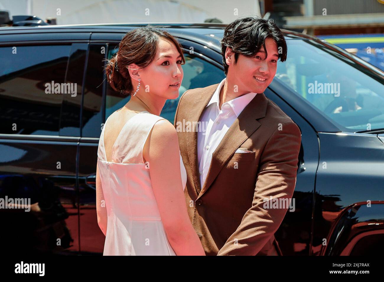 Arlington, United States. 16th July, 2024. Los Angeles Dodger designated hitter Shohei Ohtani and wife Mamiko Tanaka walk down the red carpet at the All-Star Celebrity Red Carpet Show presented by Frutitas at Globe Life Field as part of All Star Week leading up to the All Star Game in Arlington, Texas on Tuesday, July 16 2024. Photo by Matt Pearce/UPI Credit: UPI/Alamy Live News Stock Photo