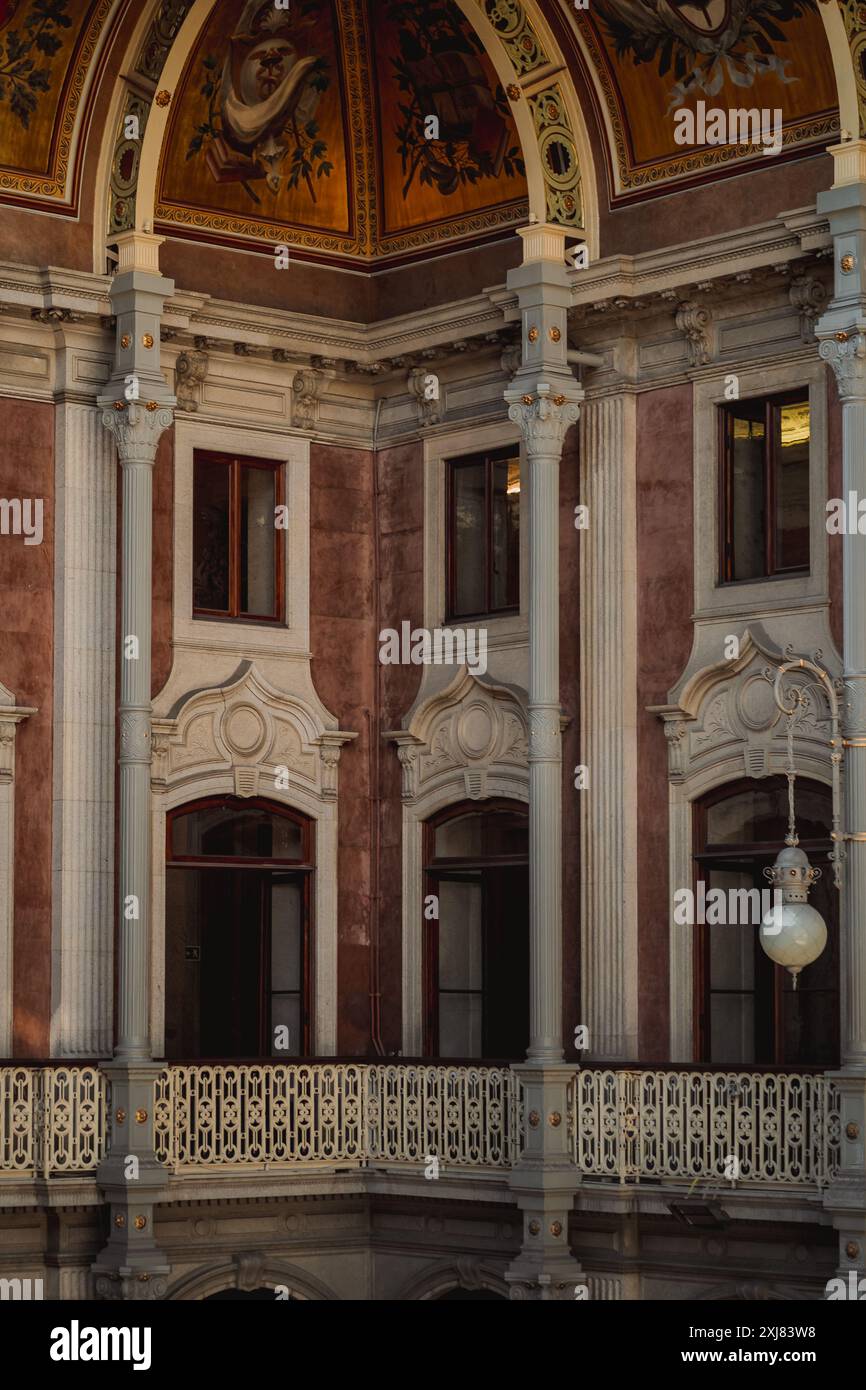 The interior of a structure featuring a balcony and pillars Stock Photo ...