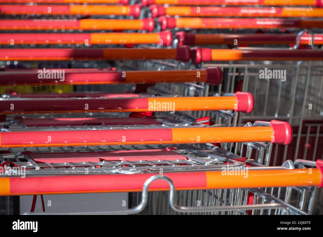 Supermarket trolleys stacked in lines Stock Photo