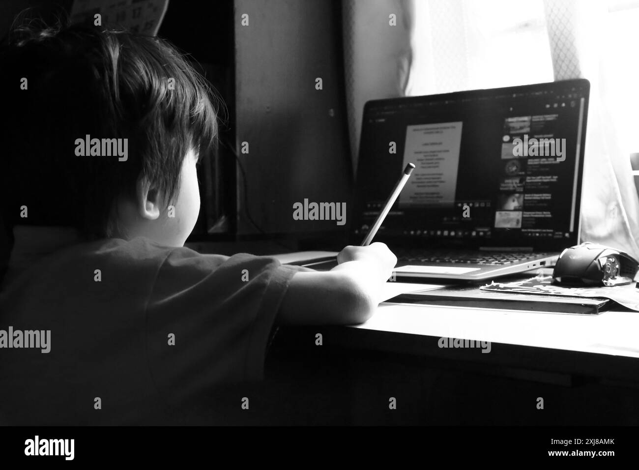 Boy studying mobile Black and White Stock Photos & Images - Alamy
