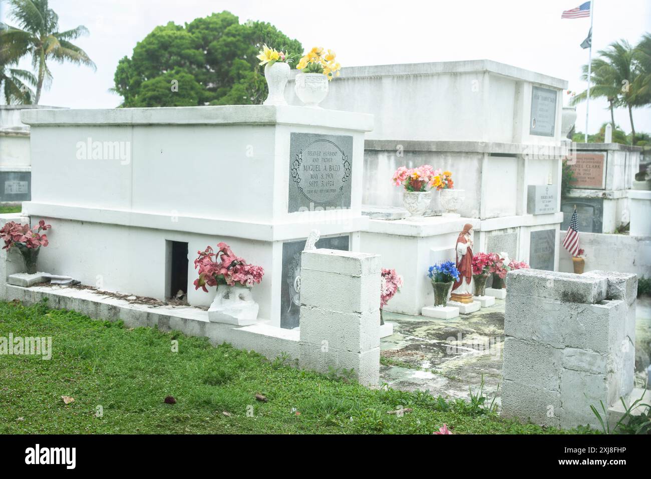 Key West America - June 26 2012; Above ground stacked burial vaults with flowers. Stock Photo