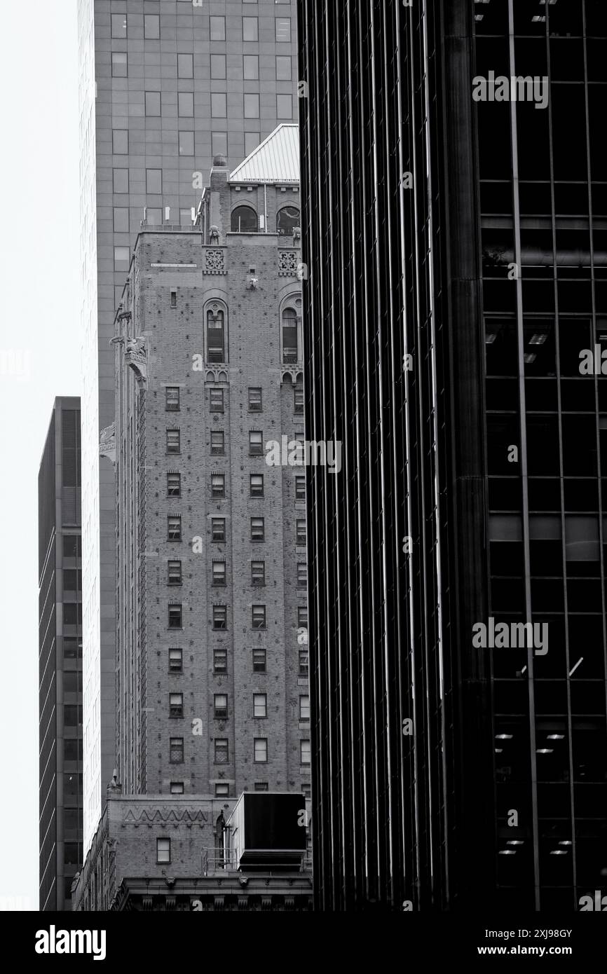 View of Looking up at gargoyles, gryphon and brickwork, details of skyscrapers ...