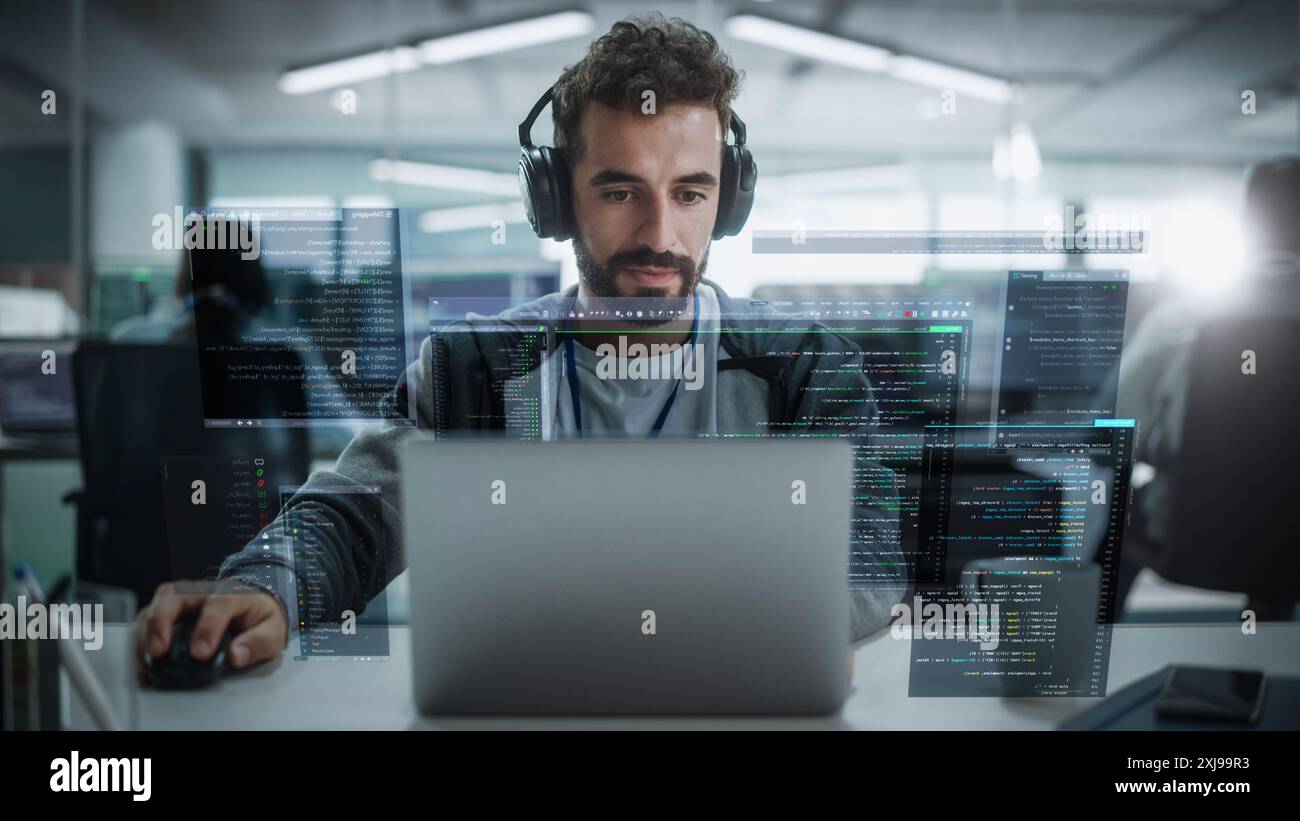 Young Hispanic Male Software Developer Working in Technological Start-Up Office. Latin Specialist Programming Monitoring Solutions. VFX Hologram Edit Visualizing Coding Interfaces, Opened Windows Stock Photo