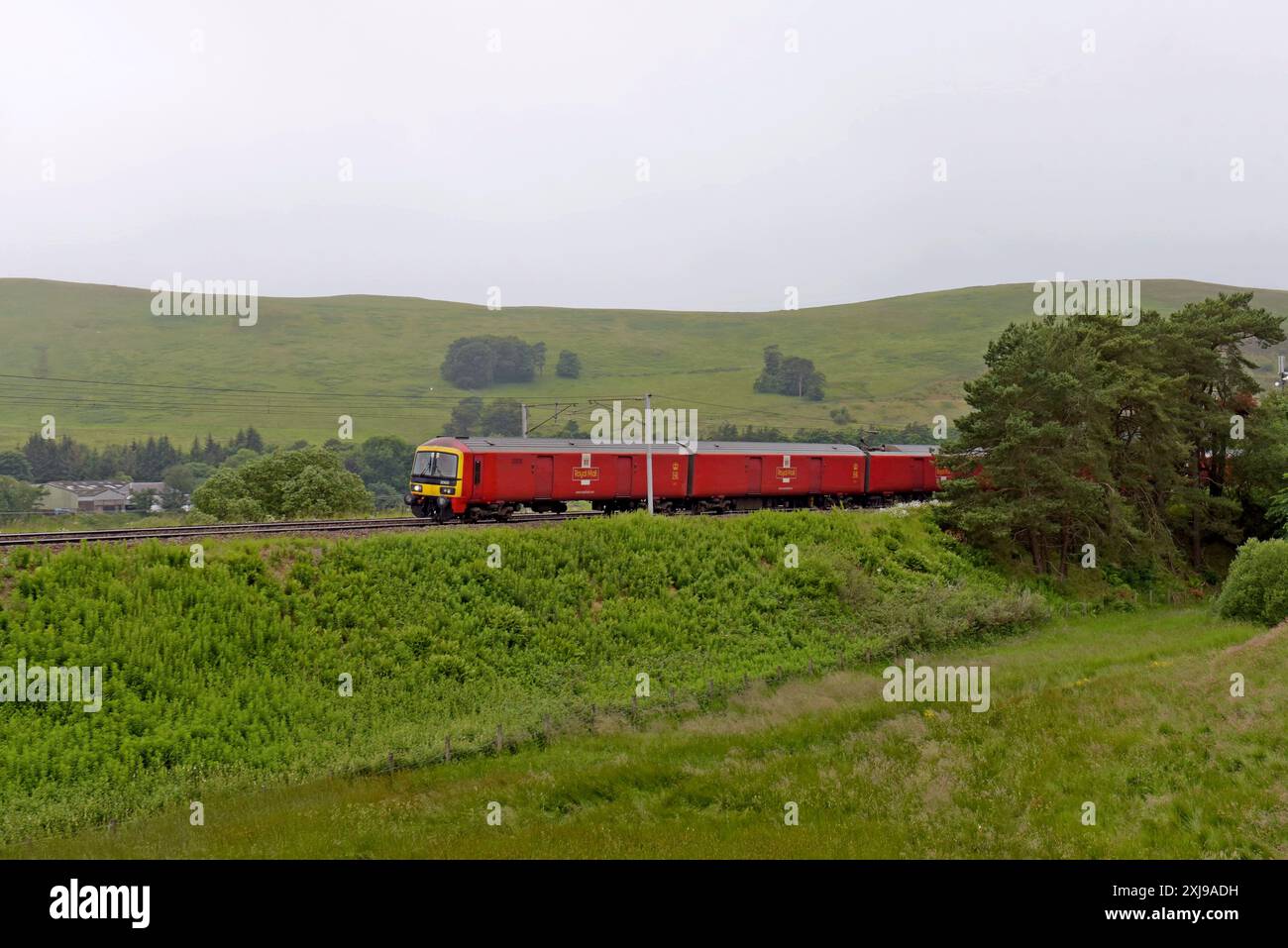 Royal Mail parcels train 325001 heading south on the West Coast Main Line near Beattock, Scotland, UK. 3rd July 2024 Stock Photo