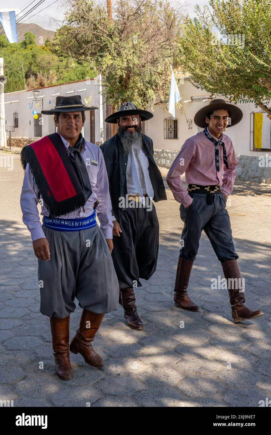 Three Gauchos In Their Traditional Outfits One With The Red Salte o 