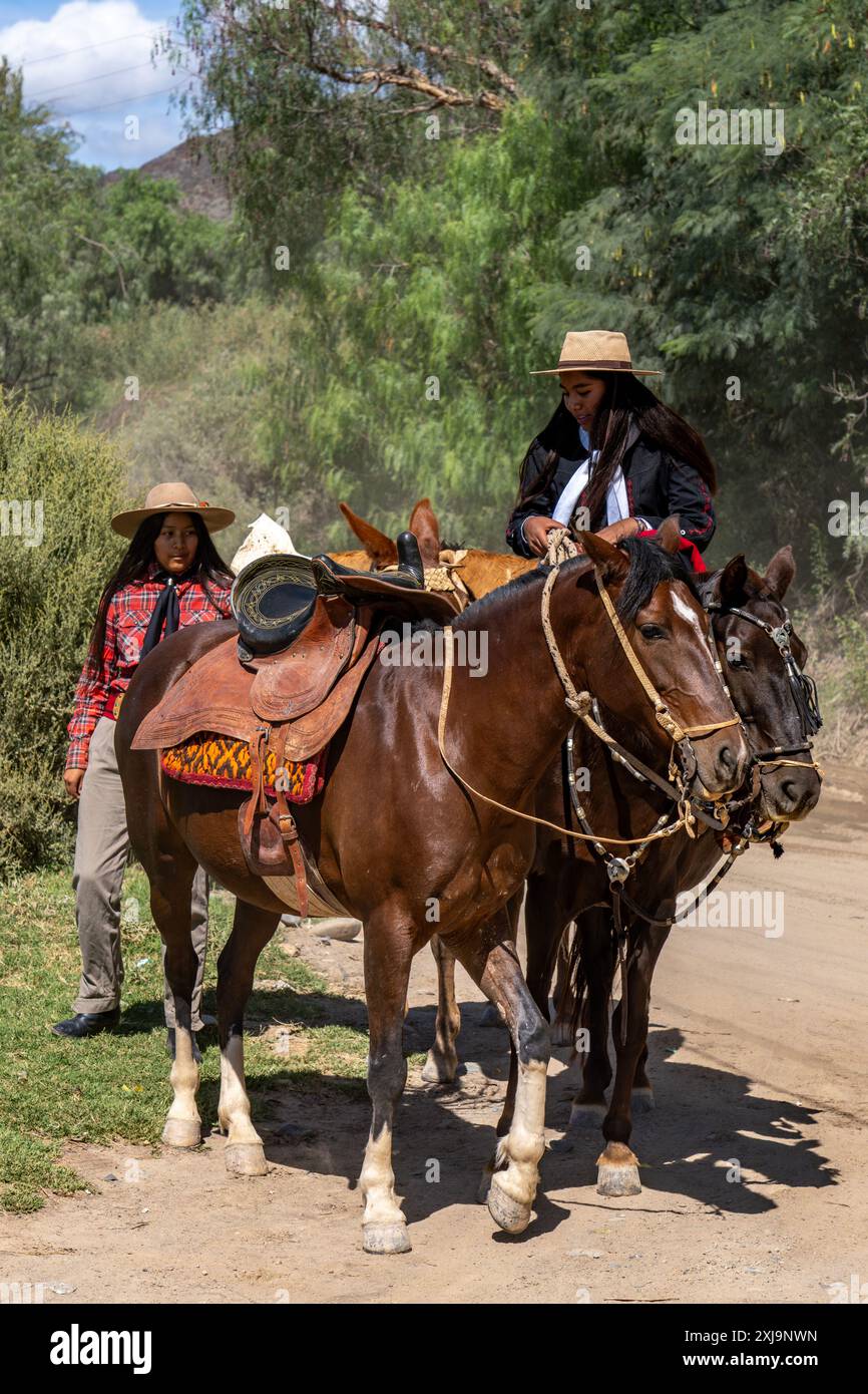 Two female gauchos in traditional dress in Cachi, Argentina. A female ...