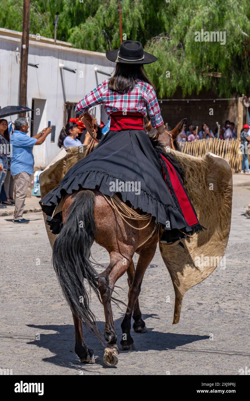 A female gaucho in traditional dress in a parade in Cachi, Argentina ...