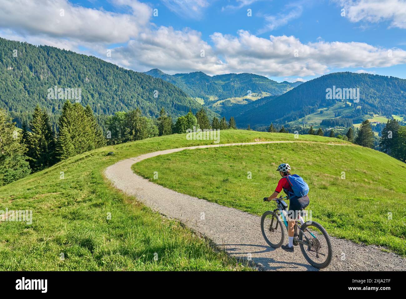 nice active senior woman riding her electric mountain bike in the ...
