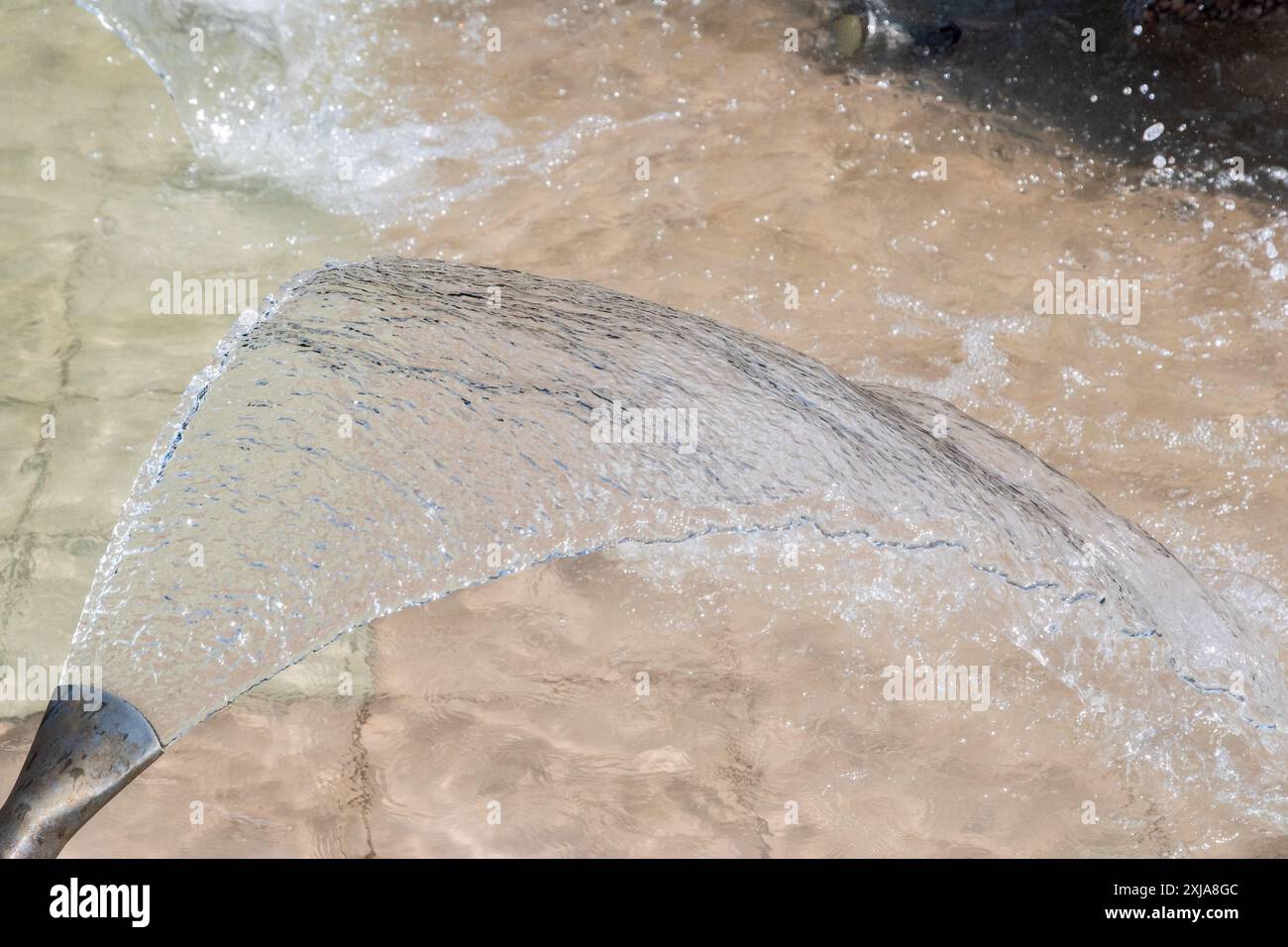 Water fountain in park, close-up of water splashing as water background Stock Photo