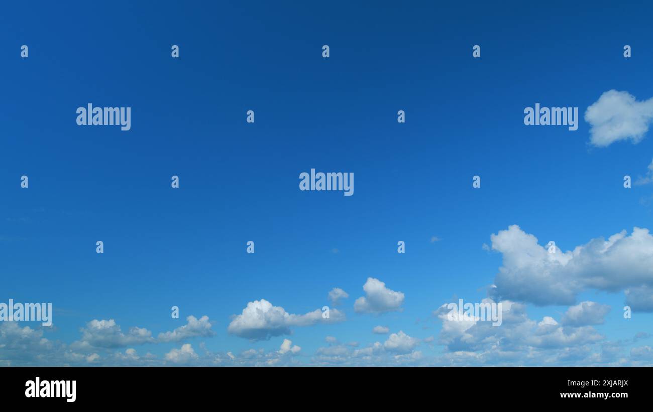 Time lapse. Summer clouds. Puffy fluffy white clouds Stock Photo - Alamy