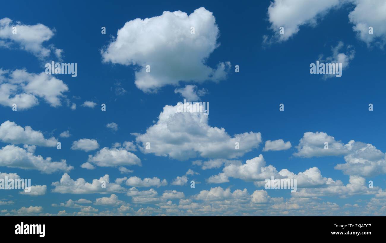 Time lapse. Summer clouds. Puffy fluffy white clouds Stock Photo - Alamy