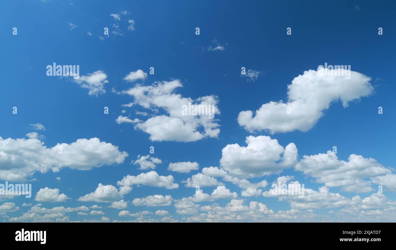 Time lapse. Puffy fluffy white cloud. Summer blue sky background Stock ...