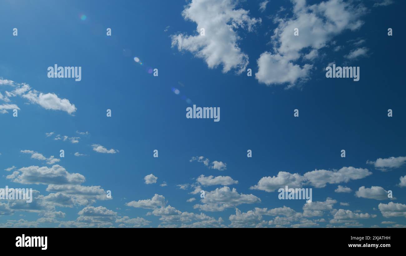 Time lapse. Puffy fluffy white cloud. Summer blue sky background Stock ...