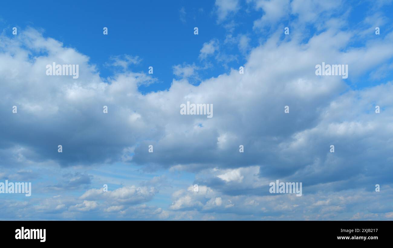 Lapse Blue Color Time lapse. Fluffy layered clouds sky atmosphere. Majestic amazing blue ...