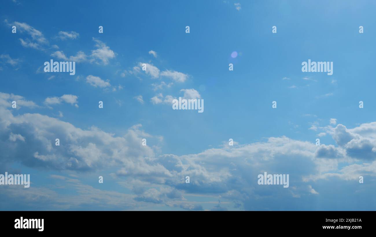 Time lapse. Puffy fluffy white cloud. Summer blue sky background Stock ...