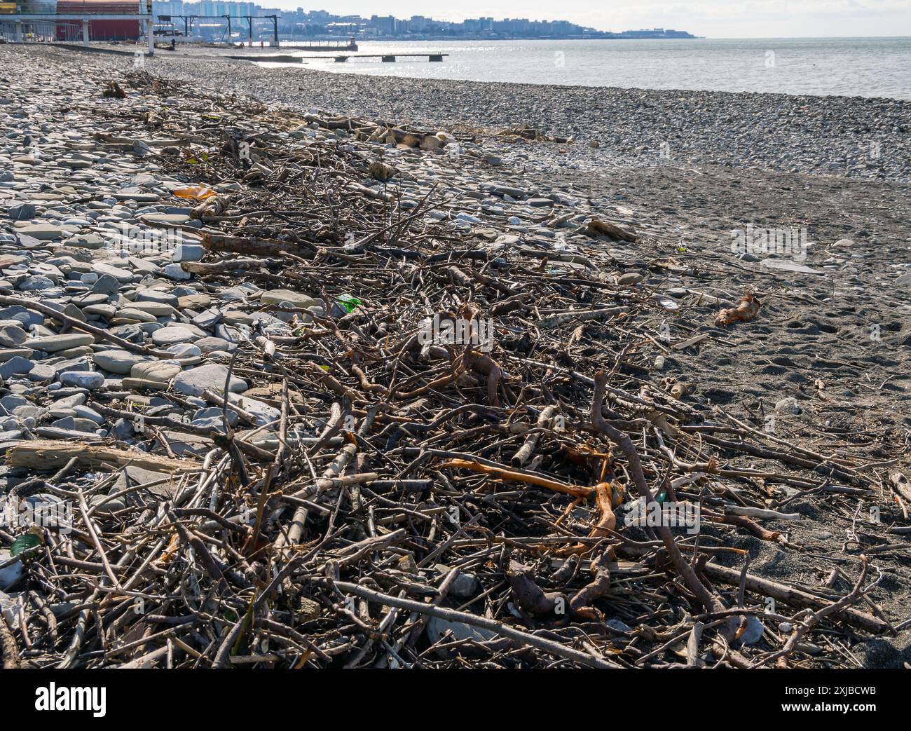 Garbage on the coastal strip of the beach after a storm, Khostinsky district of Sochi Stock Photo