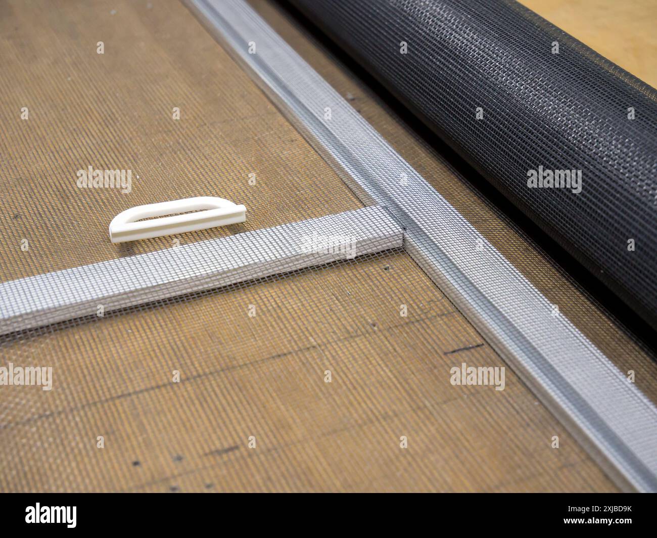 Components for making a mosquito net on a workbench Stock Photo - Alamy