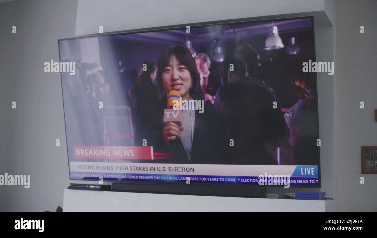 Live Report Asian female news anchor reports breaking news live on Election Day in ...