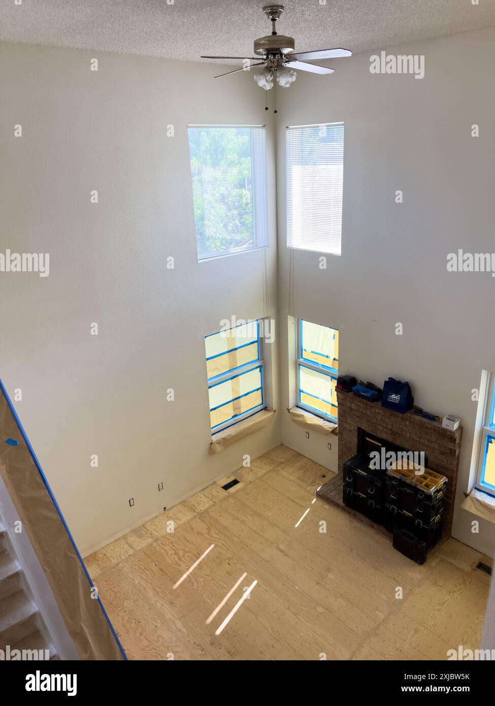 Photo inspiration: Visual Reference: Two Story Living Room Undergoing Renovation With Fireplace And Large
