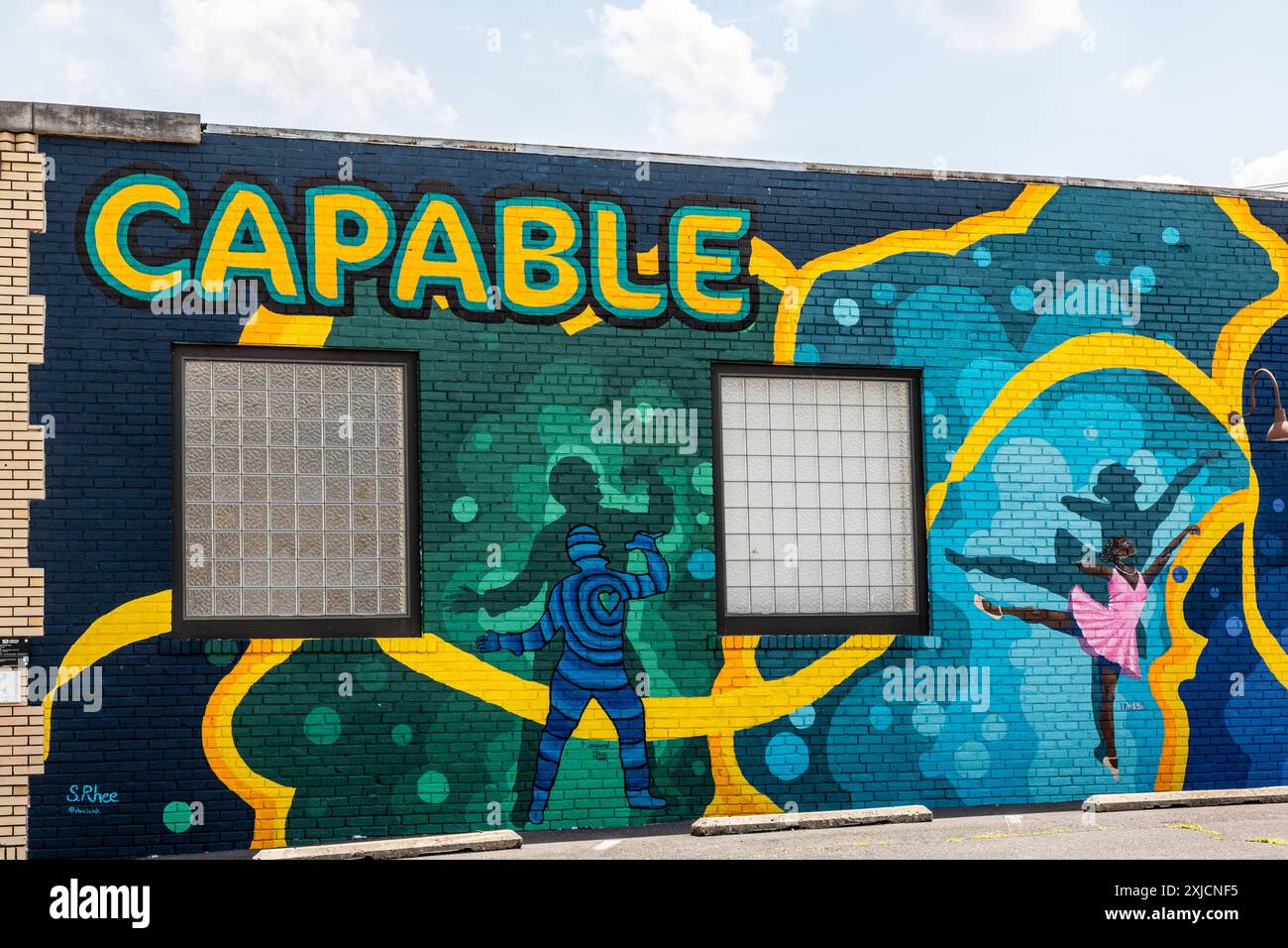 A portion of the mural 'Capable,' by Suzanne Rhee, painted on the Fletcher & Van Gilder building in Fort Wayne, Indiana, USA. Stock Photo