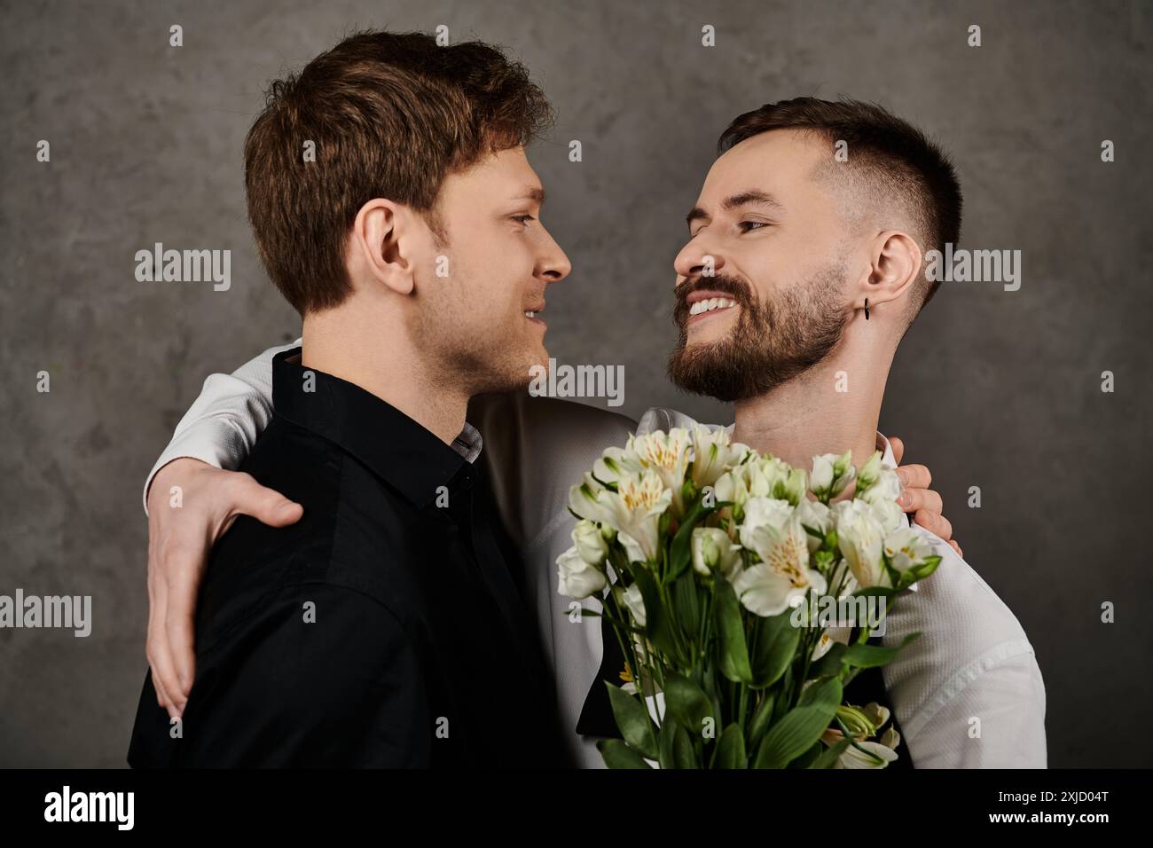 Two gay men holding other hi-res stock photography and images - Alamy