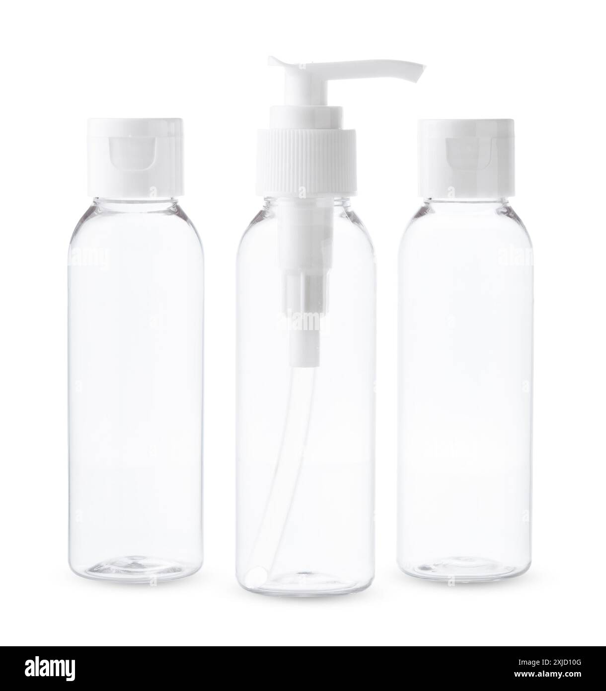 Three Clear Plastic Bottles With White Caps and Pumps on a White ...