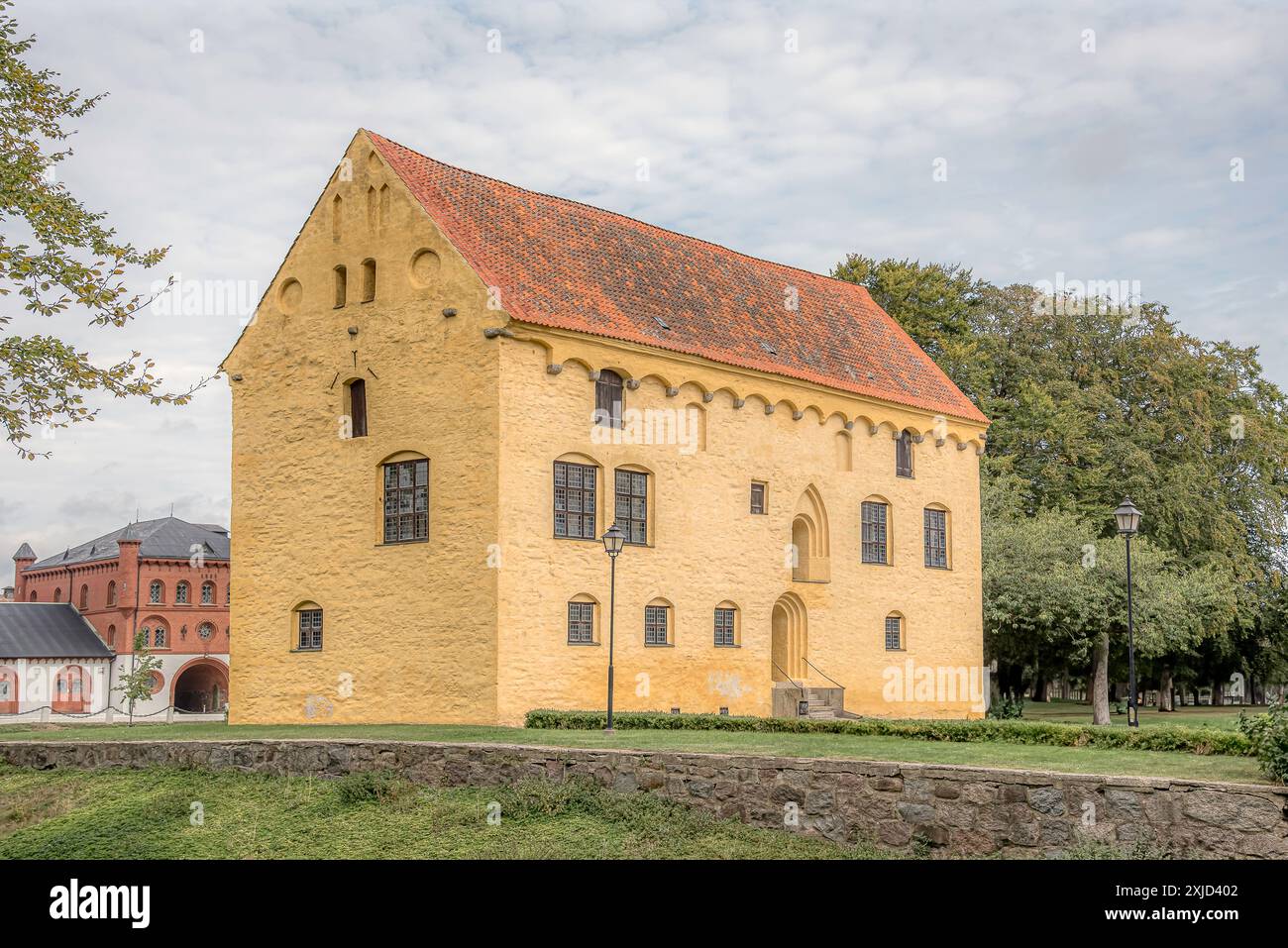 the yellow Bollerup Castle from the late 15th century in the south of ...