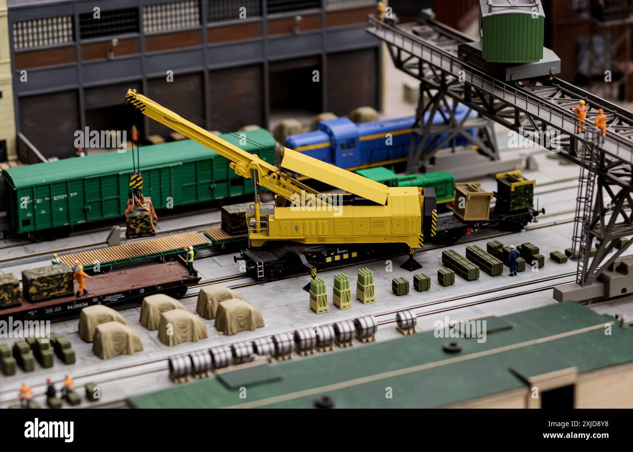 Miniature excavator model toy performs excavation work on a ...