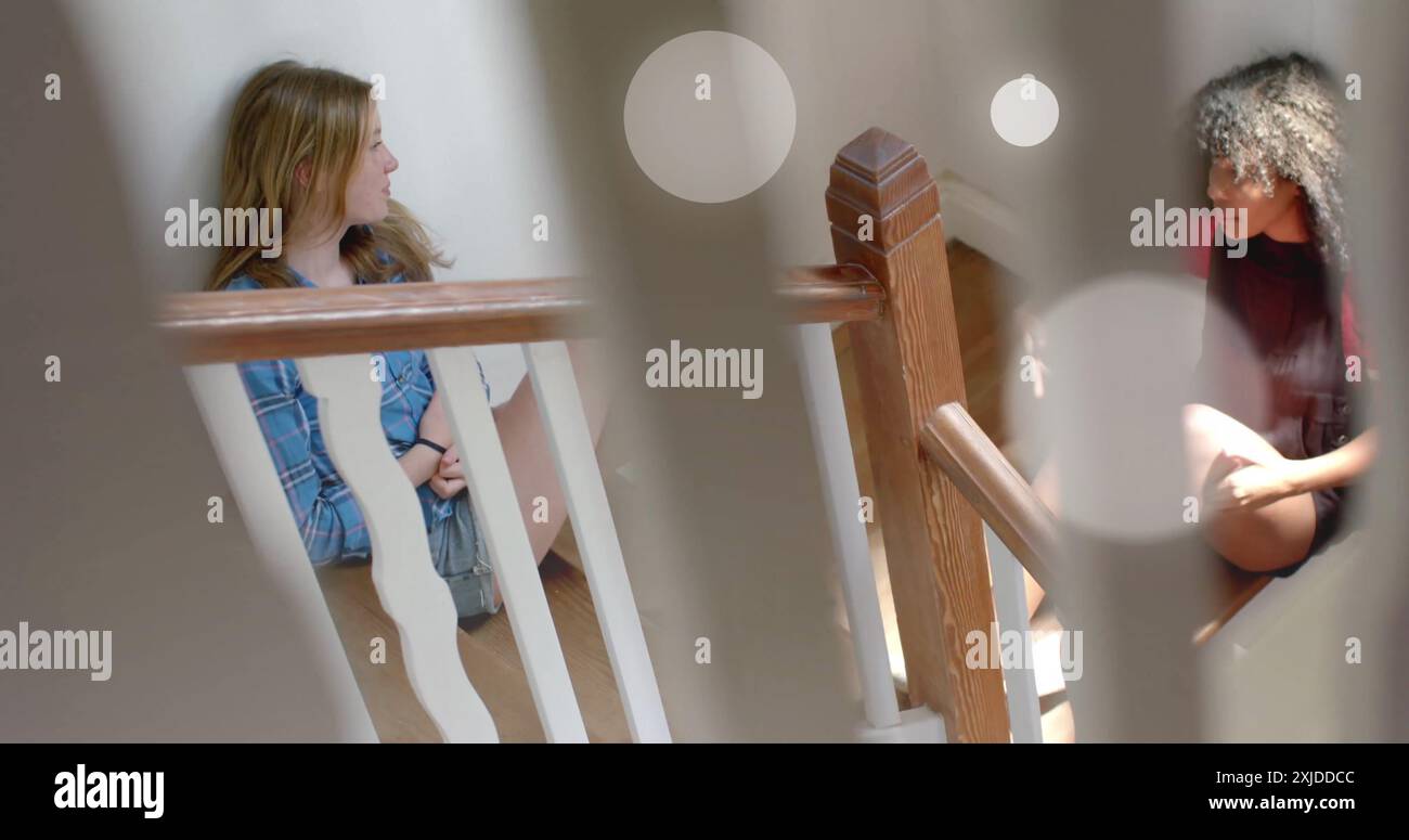 Two people sitting on stairs hi-res stock photography and images - Alamy