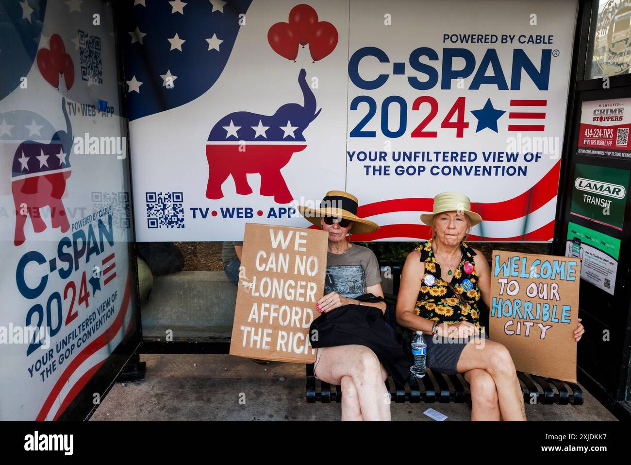 Milwaukee, United States. 15th July, 2024. Women hold signs expressing their opinions as demonstrators protest against former president Donald Trump outside Finserv Forum on the first day of the Republican National Convention (RNC) in Milwaukee, Wisconsin. The convention is going on as planned despite the assassination attempt against Trump will conclude with him accepting his party's presidential nomination. (Photo by Jeremy Hogan/SOPA Images/Sipa USA) Credit: Sipa USA/Alamy Live News Stock Photo