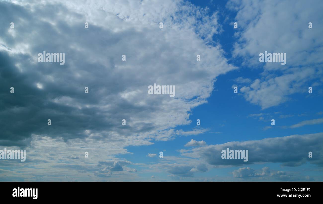 Time lapse. Summer clouds. Puffy fluffy white clouds Stock Photo - Alamy