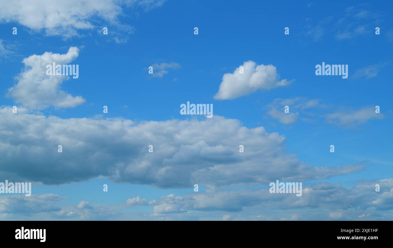 Time lapse. Summer clouds. Puffy fluffy white clouds Stock Photo - Alamy