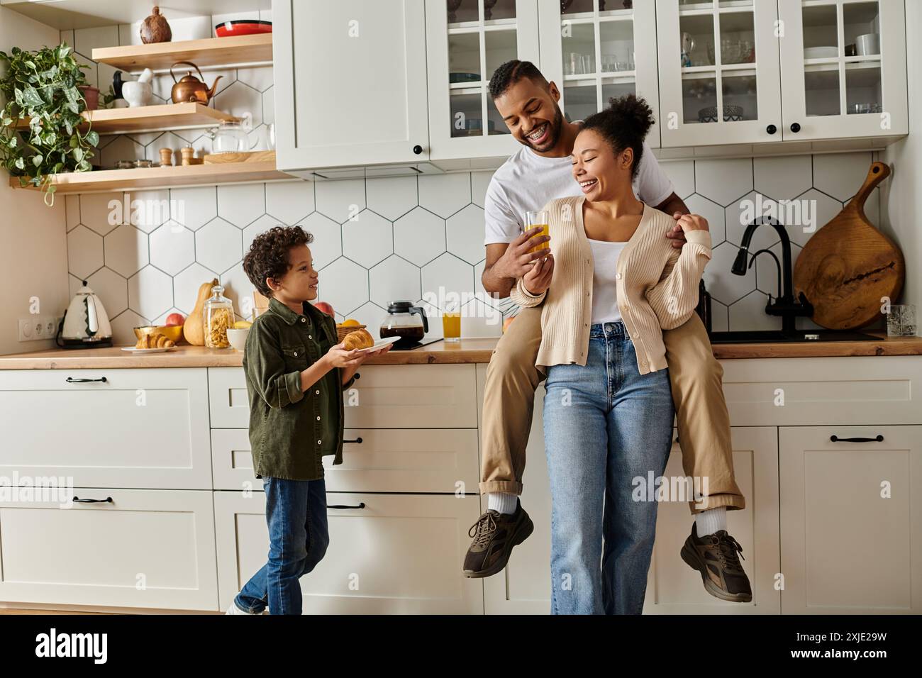 African american family in a cozy kitchen setting Stock Photo - Alamy