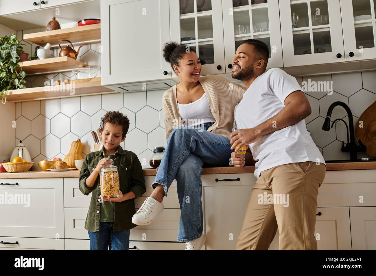 African American family bonding in a cozy kitchen Stock Photo - Alamy