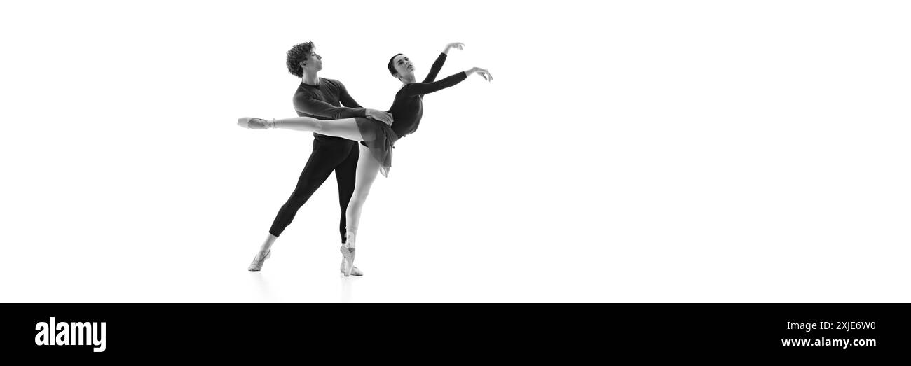 Banner. Ballet dancer training against white studio background with ...