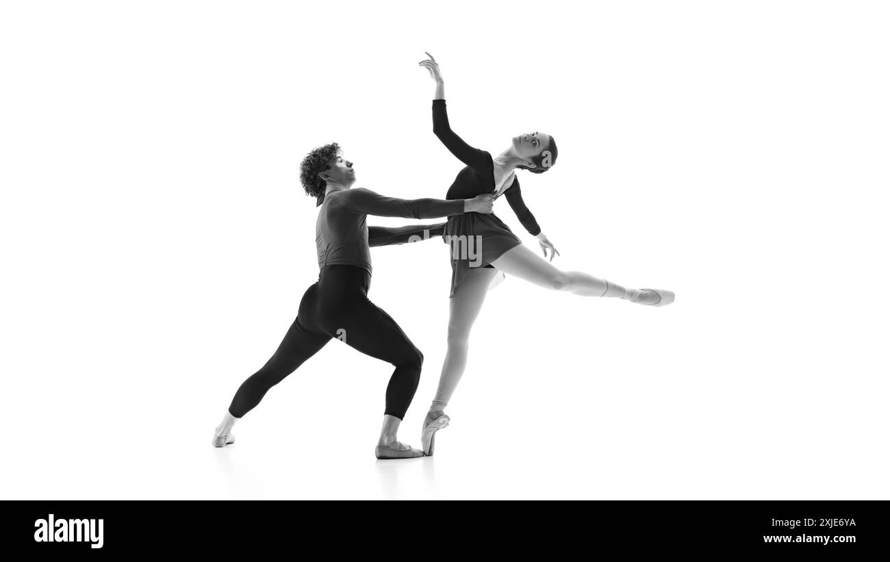 Fluid and synchronized. Ballet partners during practice against white ...