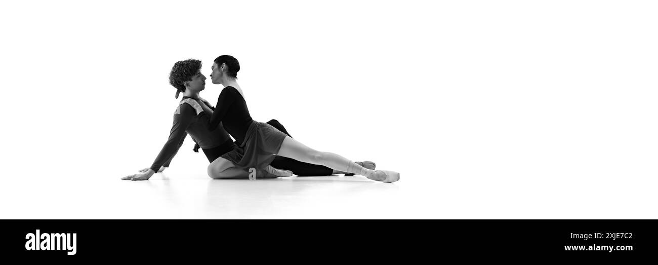 Ballet Dou Ballet duo practicing close embrace on floor shows balance, and ...