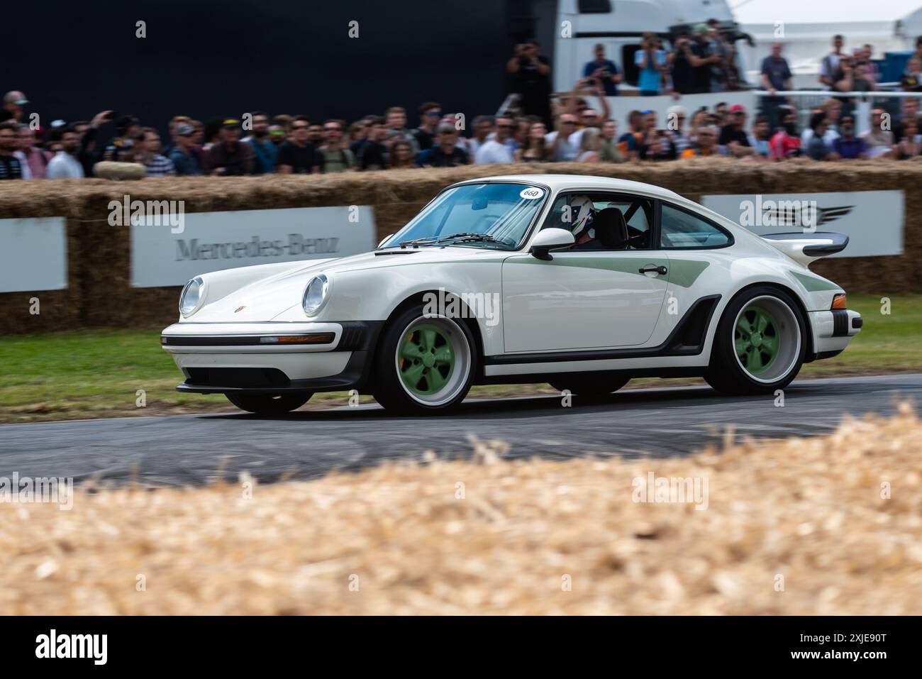 1990 Porsche 911 Reimagined by Singer car driving up the hill climb track at the Goodwood Festival of Speed 2024 motorsport event, West Sussex, UK Stock Photo