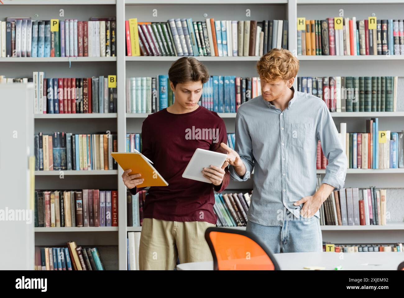 Student Library Guy College library male student searching hi-res stock photography and ...