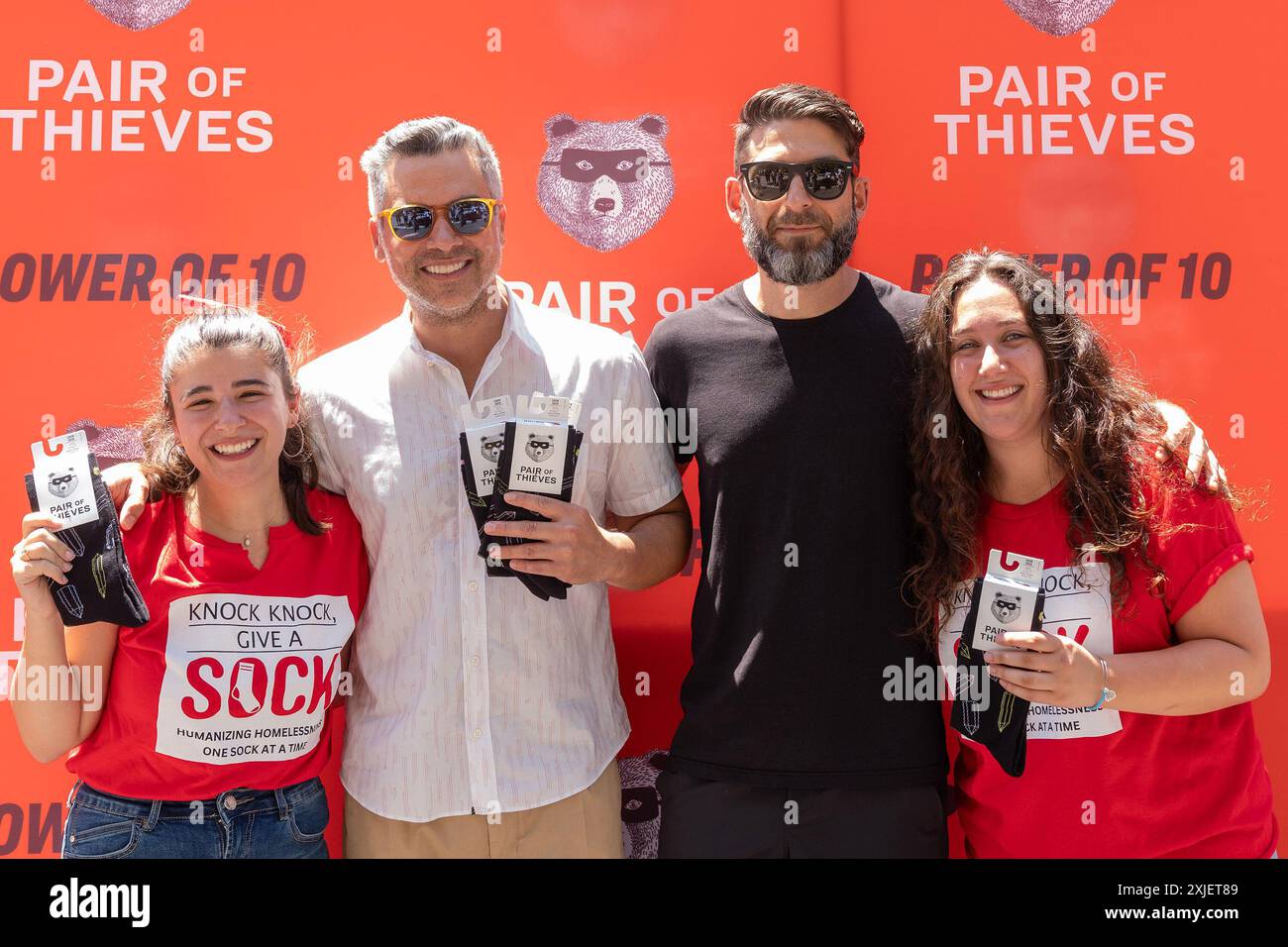 New York, United States. 11th July, 2024. (L- R) Adina Lichtman, Cash Warren, Alan Stuart and Abbi Mayerfeld attend Power of 10 campaign pop-up at North side of Washington Square Park. Pair of Thieves celebrates its 10-year anniversary as it donated 100,000 pairs of socks in partnership with 10 organizations across the country to support underserved groups and minorities. Company uses Swass-Free technology to produce their products. (Photo by Lev Radin/Pacific Press) Credit: Pacific Press Media Production Corp./Alamy Live News Stock Photo