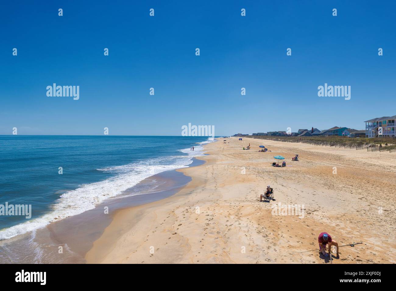 Avon, Outer Banks, North Carolina, USA - April 26, 2024:  Vacationers enjoying the beach on a sunny day in Outer Banks. Stock Photo