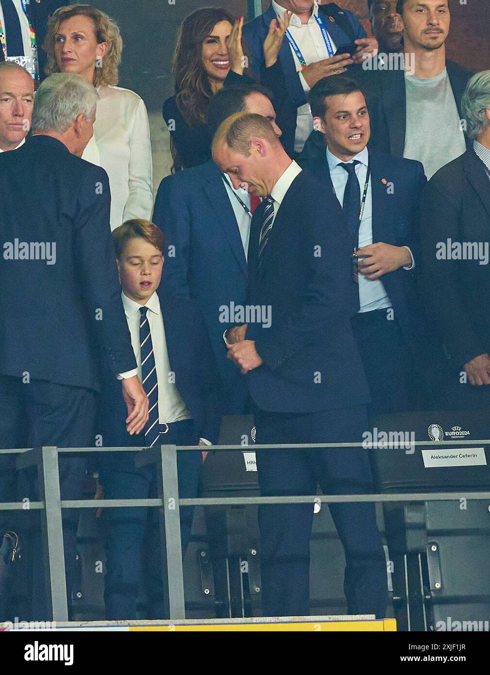 William Prince of Wales and son George  frustrated after the final match  SPAIN - ENGLAND 2-1 of the UEFA European Championships 2024  on Jul 14, 2024  in Berlin, Germany.  Photographer: Peter Schatz Stock Photo