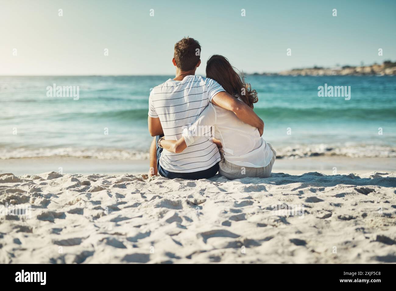 Sand, couple and relax on beach for love, commitment and bonding on ...