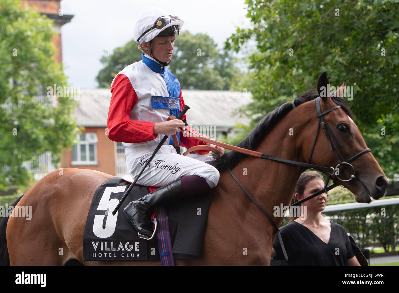 Ascot, Berkshire, UK. 13th July, 2024. Horse Fair Point ridden by jockey Rob Hornby heads out onto the racetrack for the Village Hotels Fillies' Handicap Stakes at Ascot Racecourse in Berkshire at the Summer Mile Family Raceday. Owner The Eclipse Partnership, Trainer Ralph Beckett, Kimpton Down, Breeder and Sponsor Car Colston Hall Stud. Credit: Maureen McLean/Alamy Stock Photo