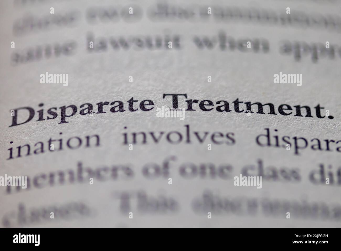 disparate treatment printed in text on page as visual aid or business law reference Stock Photo