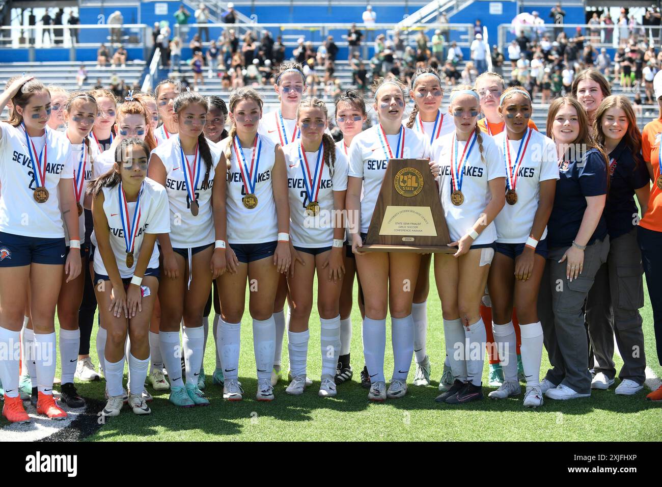Katy Seven Lakes team members pose with semifinalist trophy after