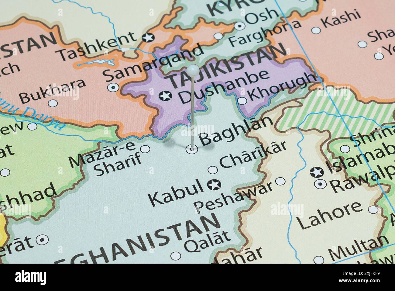 Close up to a Baghlan city with a white pin needle into Afghanistan country political map Stock Photo