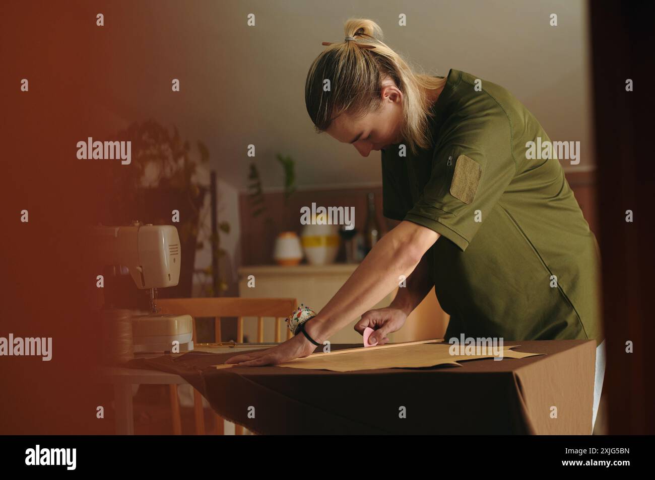 Fashion Designer Working In Workshop Stock Photo